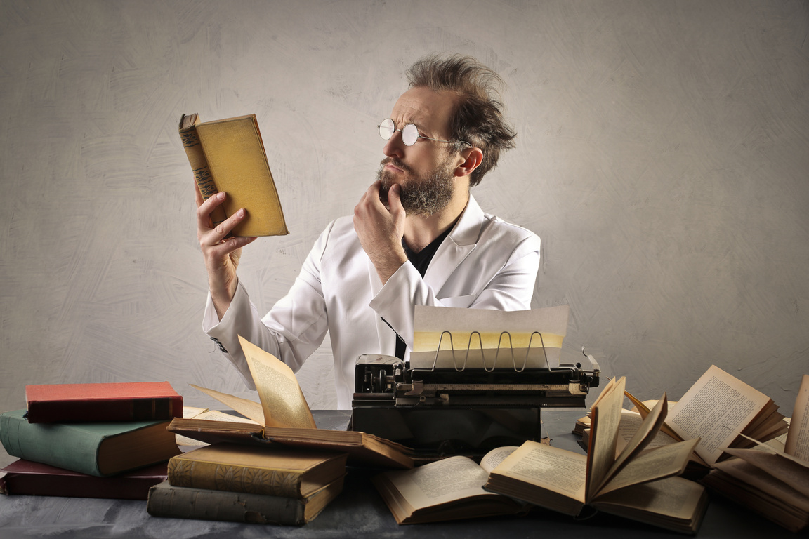 Writer reading vintage books