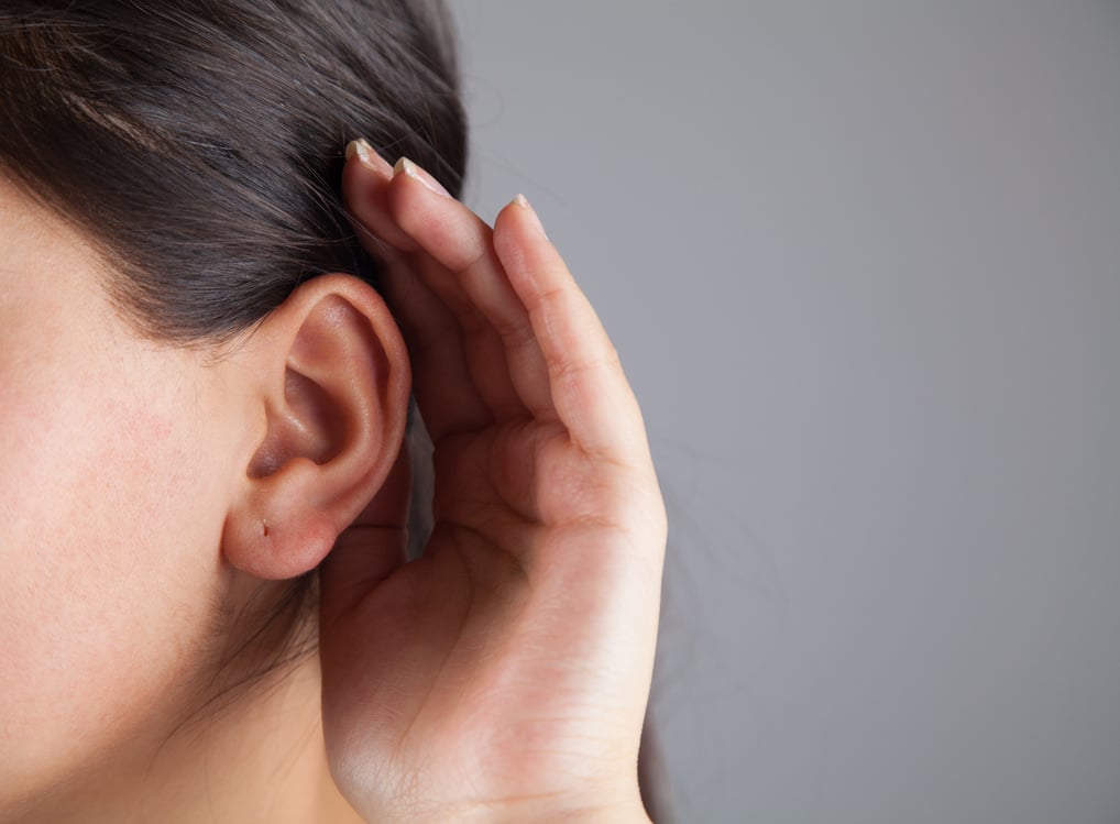 Young woman with hearing loss or hard of hearing.